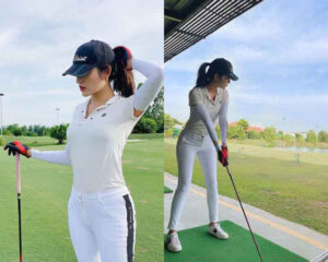 Một người phụ nữ mặc quần áo golf